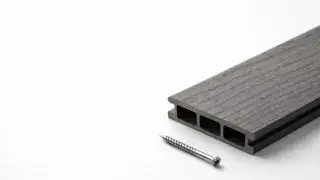 Composite decking FAQ cover image showing hollow-core board cross section and deck screw.