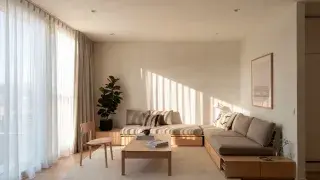 Minimalist living room with low wood furniture, neutral tones, and soft natural light.