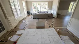 A residential living-dining room in the active space-planning stage.