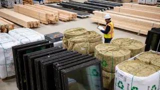 A construction jobsite staging area showing early-purchase sustainable building components.