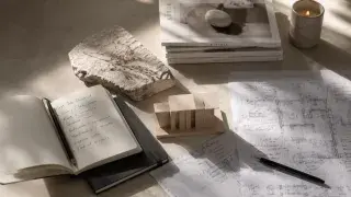 Architecture model, drawings, ruler, and first-job checklist on a quiet studio table.