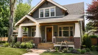 Craftsman house with repaired porch, trim, and near-finished exterior renovation.