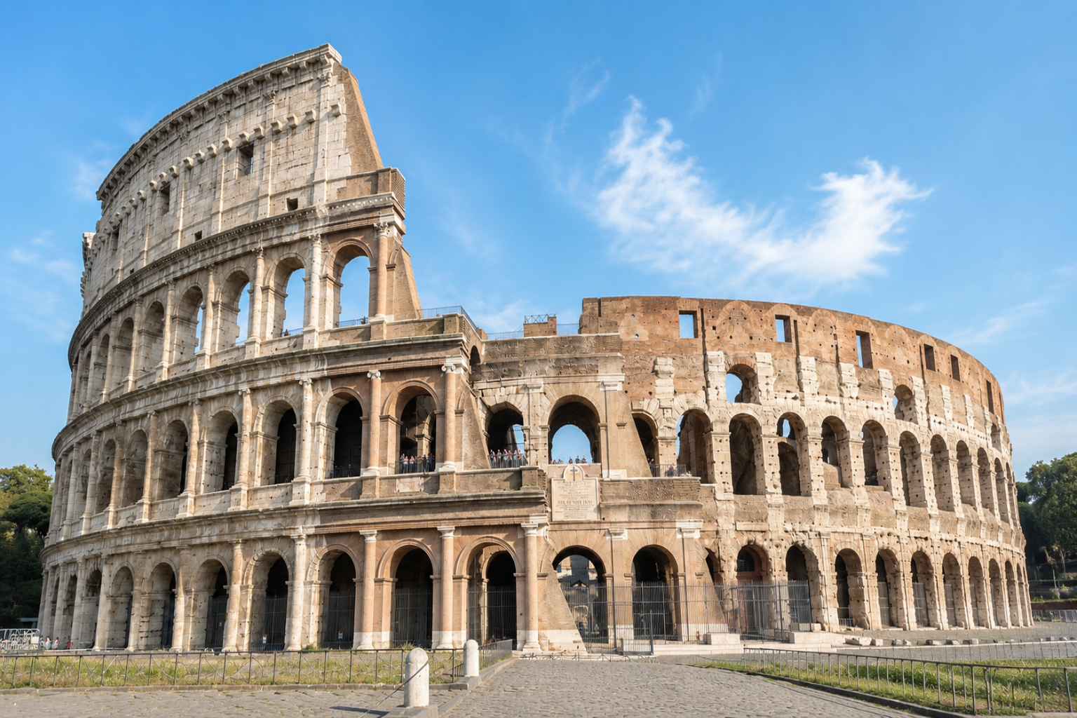 Bright daytime view of the Roman Colosseum and its weathered exterior arches.