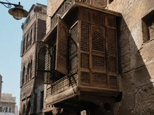 Traditional wooden mashrabiya screen projecting from an upper-floor window and filtering sunlight over a narrow historic street.
