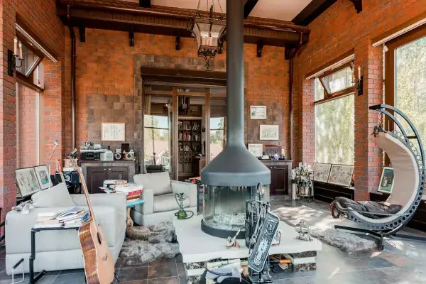 living room with leather armchairs and hammock chair