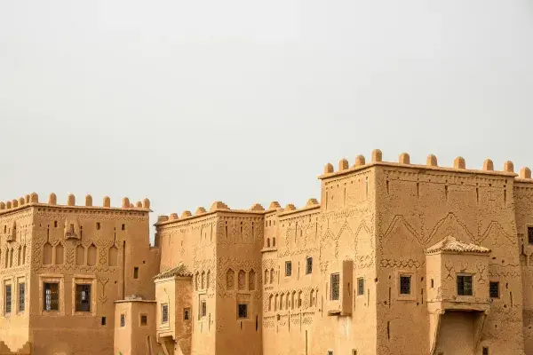 Ancient historical buildings with towers, constructed using vernacular clay materials.