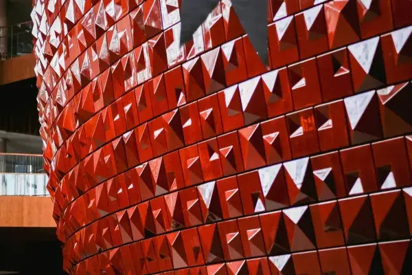A high-quality architectural presentation showcasing a red-tiled structure, with detailed renderings and expert analysis.