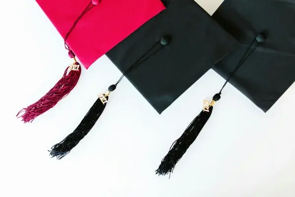 Close-up shot of mortarboards for architecture science degrees, symbolizing academic achievement.