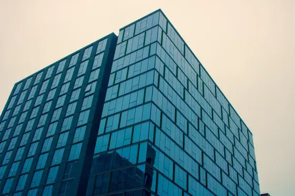 Modern glass commercial building in a downtown area.