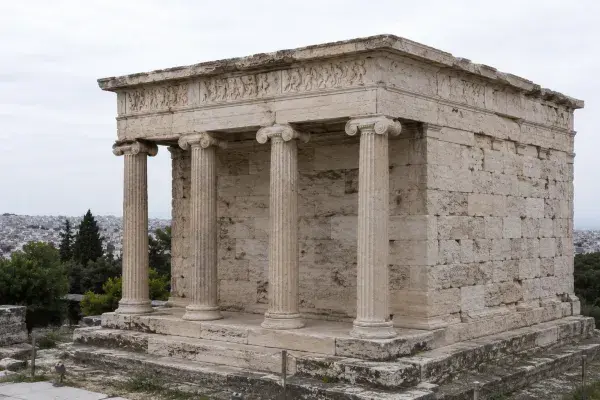 Ancient Greek columns with carved frieze.