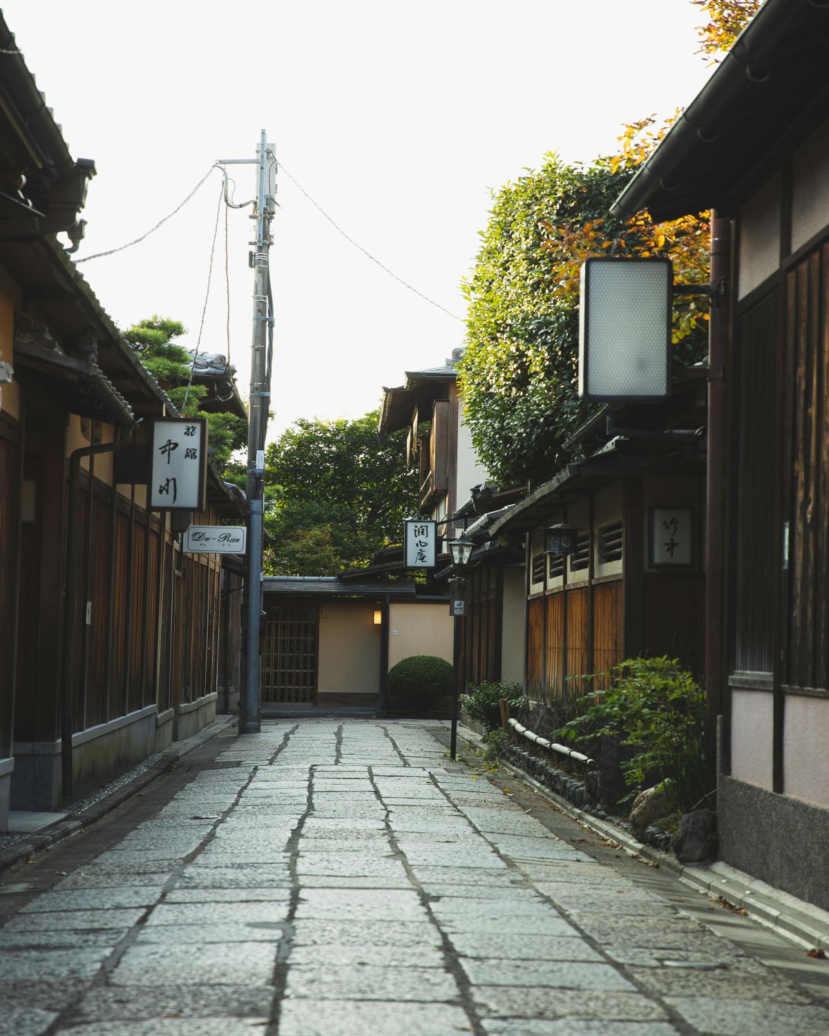 Quiet Kyoto alleyway showing how wood, stone, and air shape the sensory design of space through scent and atmosphere.